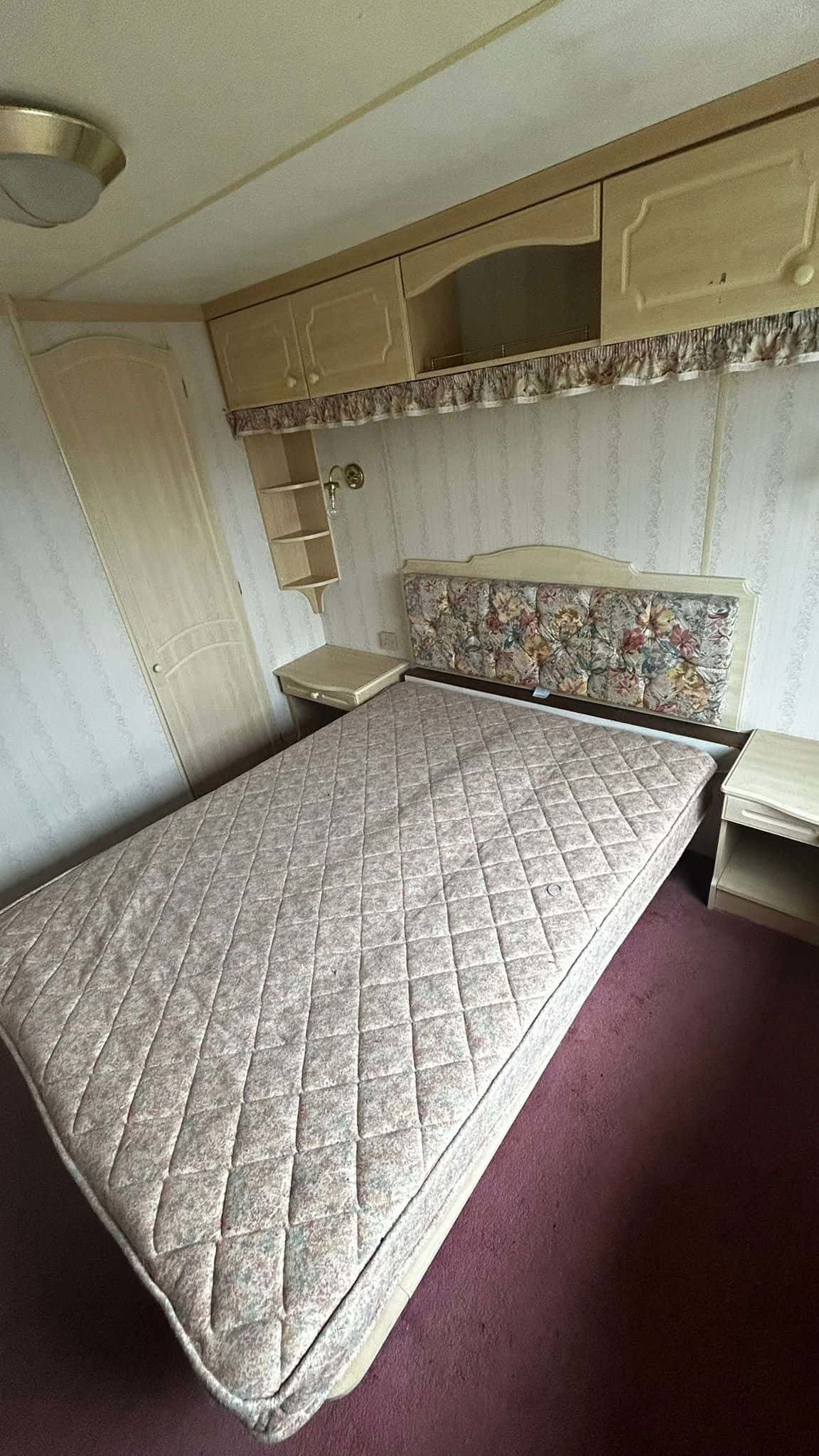 Double bed with bedside cabinets in Static Caravan