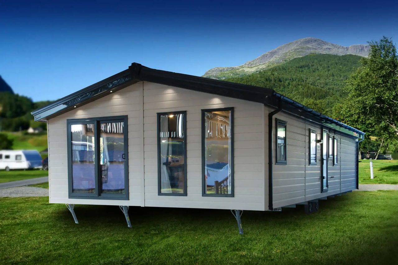 large clad lodge with patio doors and two large front windows