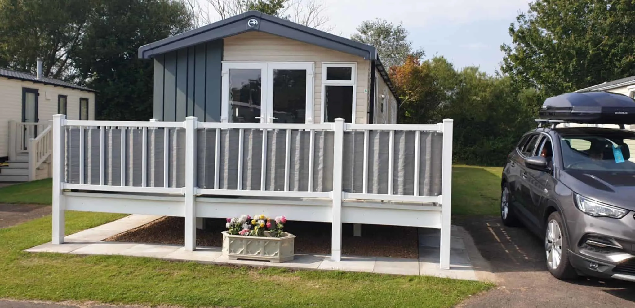 Front view of Swift Static Caravan with white fence