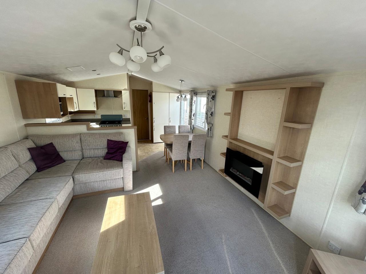 Willerby Avonmore, shelving on walls around fire, large corner sofa